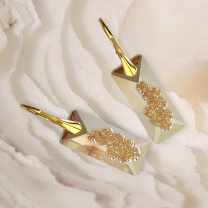 Highest quality Austrian crystal earrings shown in Golden Shadow,. The centre of the crystal is designed to look as if the crystal is still growing and catches the light beaufifully. Suspended from gold plated sterling silver lever back wires and gift boxes.