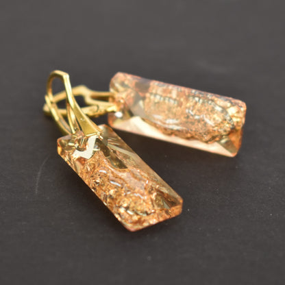 Highest quality Austrian crystal earrings shown in Golden Shadow,. The centre of the crystal is designed to look as if the crystal is still growing and catches the light beaufifully. Suspended from gold plated sterling silver lever back wires and gift boxed