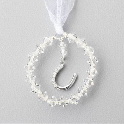 A circle of crystals surrounds a sterling silver horseshoe studded with tiny zircona. The perfect bouquet charm. The horsehoe is detachable for use as a pendant after the event. 