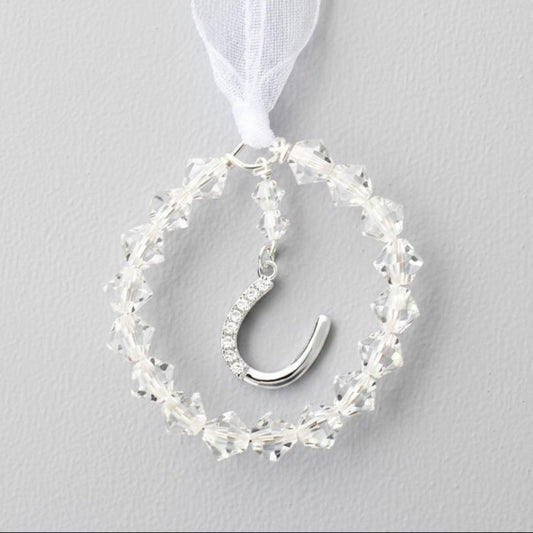 A circle of crystals surrounds a sterling silver horseshoe studded with tiny zircona. The perfect bouquet charm. The horsehoe is detachable for use as a pendant after the event. 