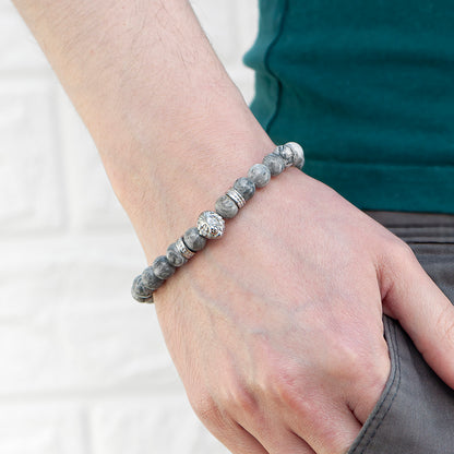 Grey jasper beads with a central lion's head in stainless steel. The barrel clasp can be engraved with up to three initials and a message of up to 15 charactes includingspaces. Arrives gift boxed. Shown worn.