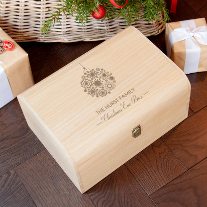 Wooden Christmas Eve Box with engraved bauble design. Personalised with your family name above the words "Christmas Eve Box". Available in two sizes 
