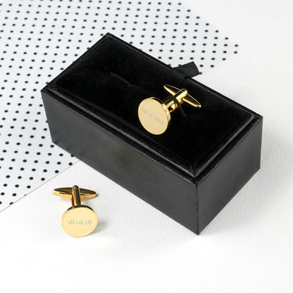 Circular gold plated cufflink shown with Mr & Mrs on one link and the date on the other, resting on gift box