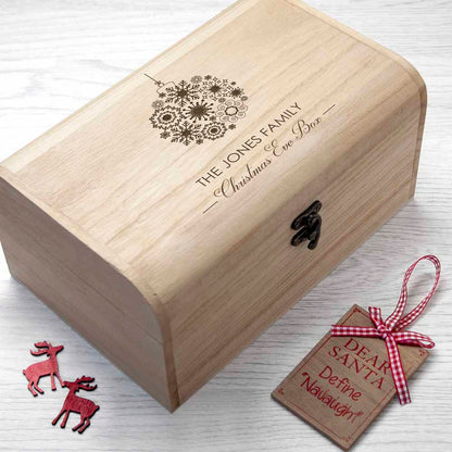 Wooden Christmas Eve Box with engraved bauble design. Personalised with your family name above the words "Christmas Eve Box". Available in two sizes 
