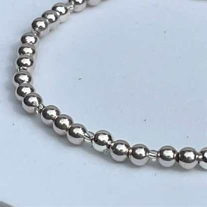silver plated elasticated bracelet, 4mm beads and tiny silver separators. 19cm elasticated. Wear on its own or part of a stack!