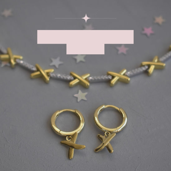 video showing golden kisses necklace and matching hoop earrings