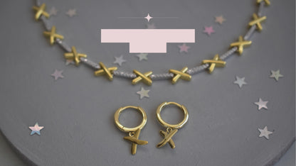 video showing golden kisses necklace and matching hoop earrings