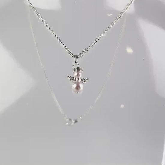 Snow angel pendant in variety of glass pearl covers, two glass pearls with angel wings and halo on silver plated chain.