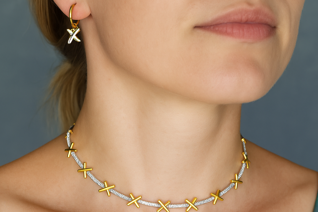 The golden kisses necklace. Sterling silver gold plated "kisses" separated by sparkling zircona bars. Shown with matching "kisses" earrings.