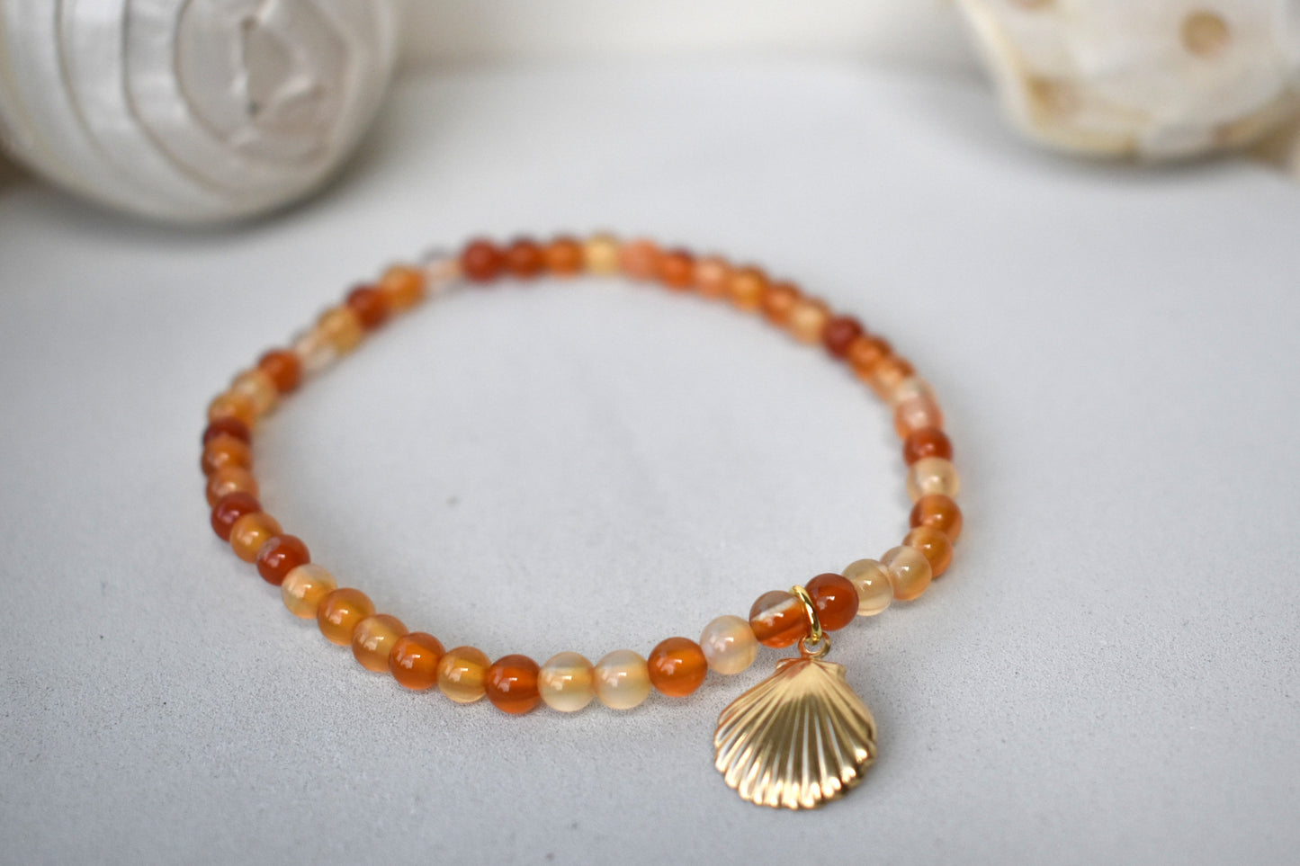 Carnelian elasticated bracelet with sterling silver gold plated shell