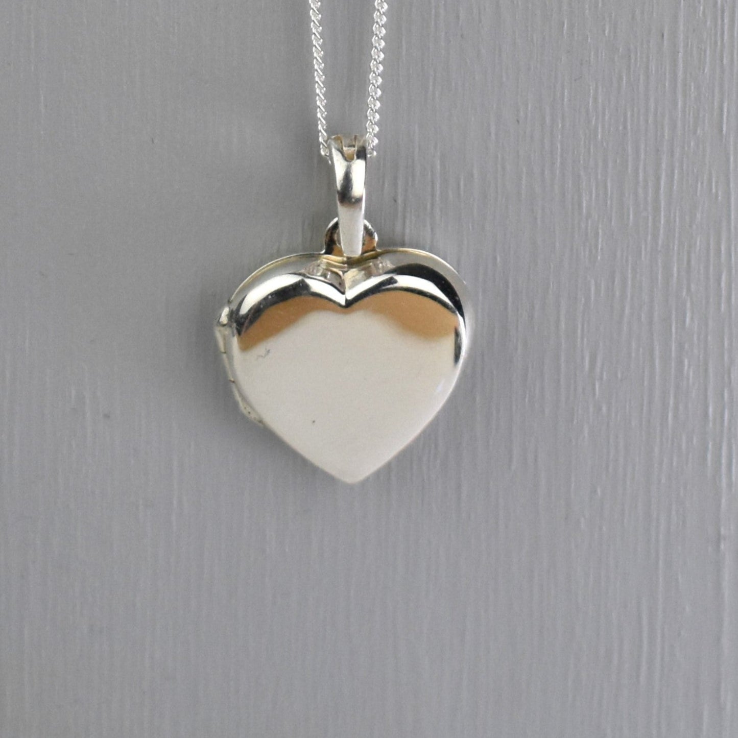 sterling silver heart locket removed from bouquet charm and placed on chain
