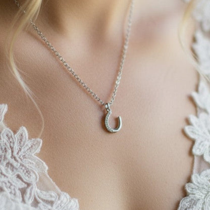 The pretty horseshoe charm can be detached and added to the optional chain so that it can be worn long after the wedding day.