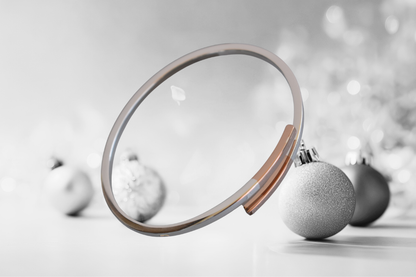 Sterling silver cross over bangle with rose gold tipped ends
