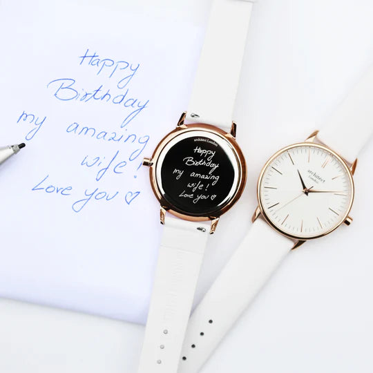 Ladies architect watch with white face and strap showing own handwriting engraving on reverese