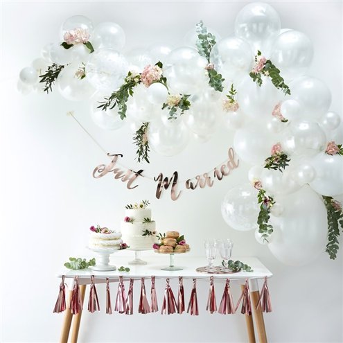 light rose garland cut and used in a white balloon arch
