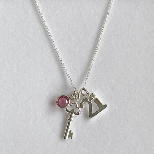Pretty 21st birthday charm with a key pendant and birthstone.