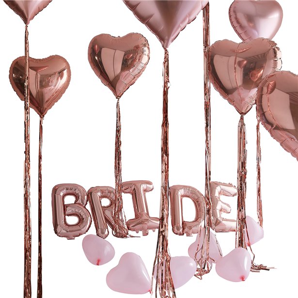 Decoration kit for the Bride's bedroom on the morning of the wedding. With rose gold heart balloons, tassels, and balloons spelling Bride