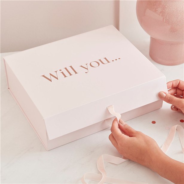 Pretty gift box with magnetic closure and velvet ribbon has rose gold foil lettering on the front stating "Will You ...