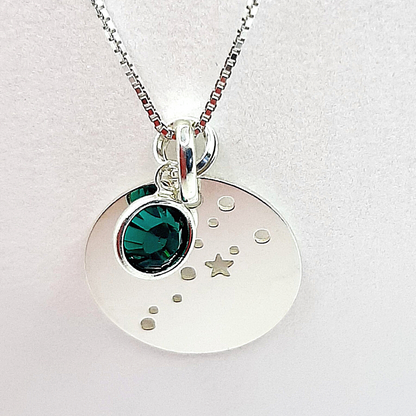 Sterling silver constellation pendant. Silver disc is cut out to show alignment of stars and planets in  your birth constellation. Accompanied by a high quality crystal birthstone and suspended from a sterling silver chain