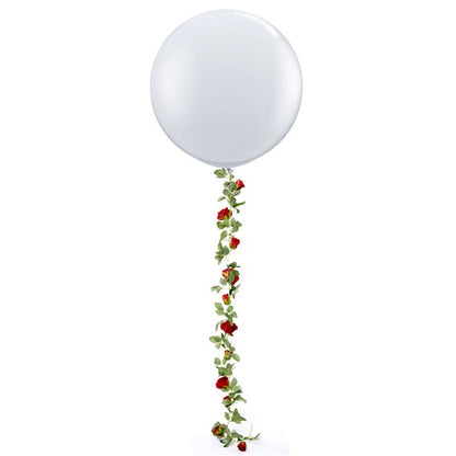 Red rose garland shown attached to large balloon