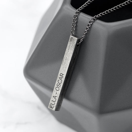 Gunmetal grey bar on gunmetal chain. Bar is engraved with the name of your choice.