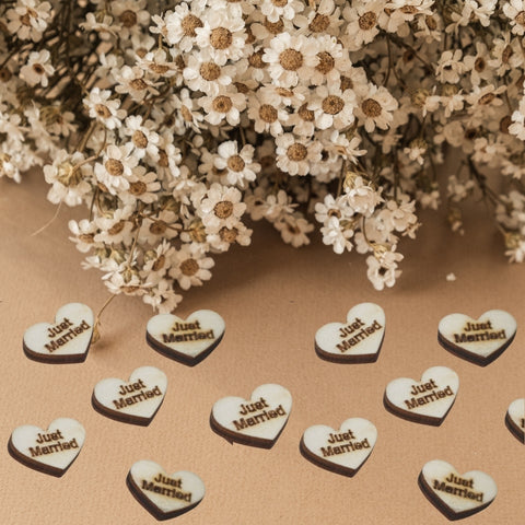 Wooden table confetti. Solid wooden hearts with the message just married