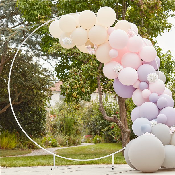 A large white hoop that is free standing and can be used for flower or balloon displays.