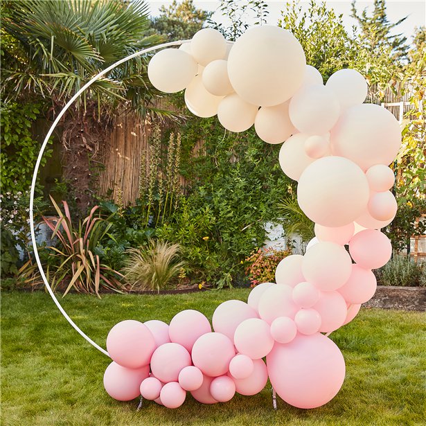 A large white hoop that is free standing and can be used for flower or balloon displays.