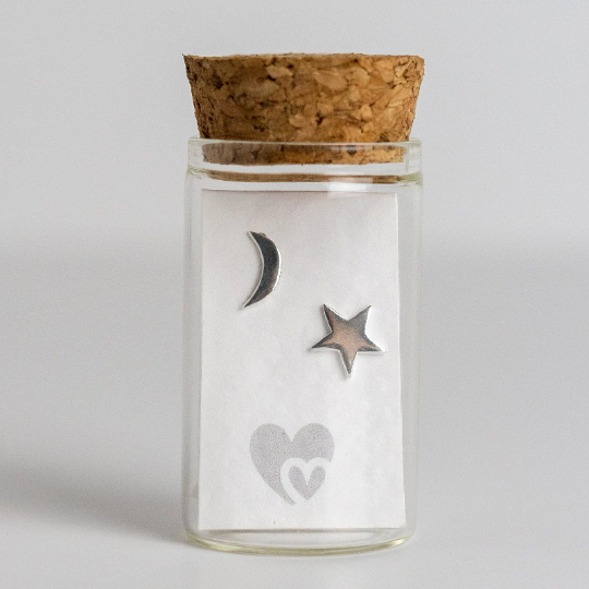These cute sterling silver moon and star  earrings are perfect to wear every day. Part of our Message in a Bottle range, they come in a little glass bottle complete with cork lid and a scroll for you to write your own message.