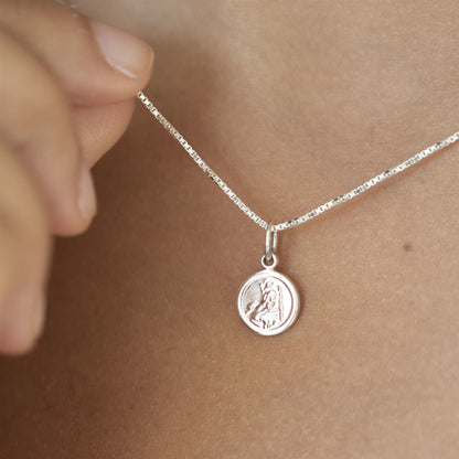 Tiny St. Christopher shown in sterling silver