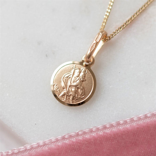 Tiny St. Christopher shown in 9 ct gold