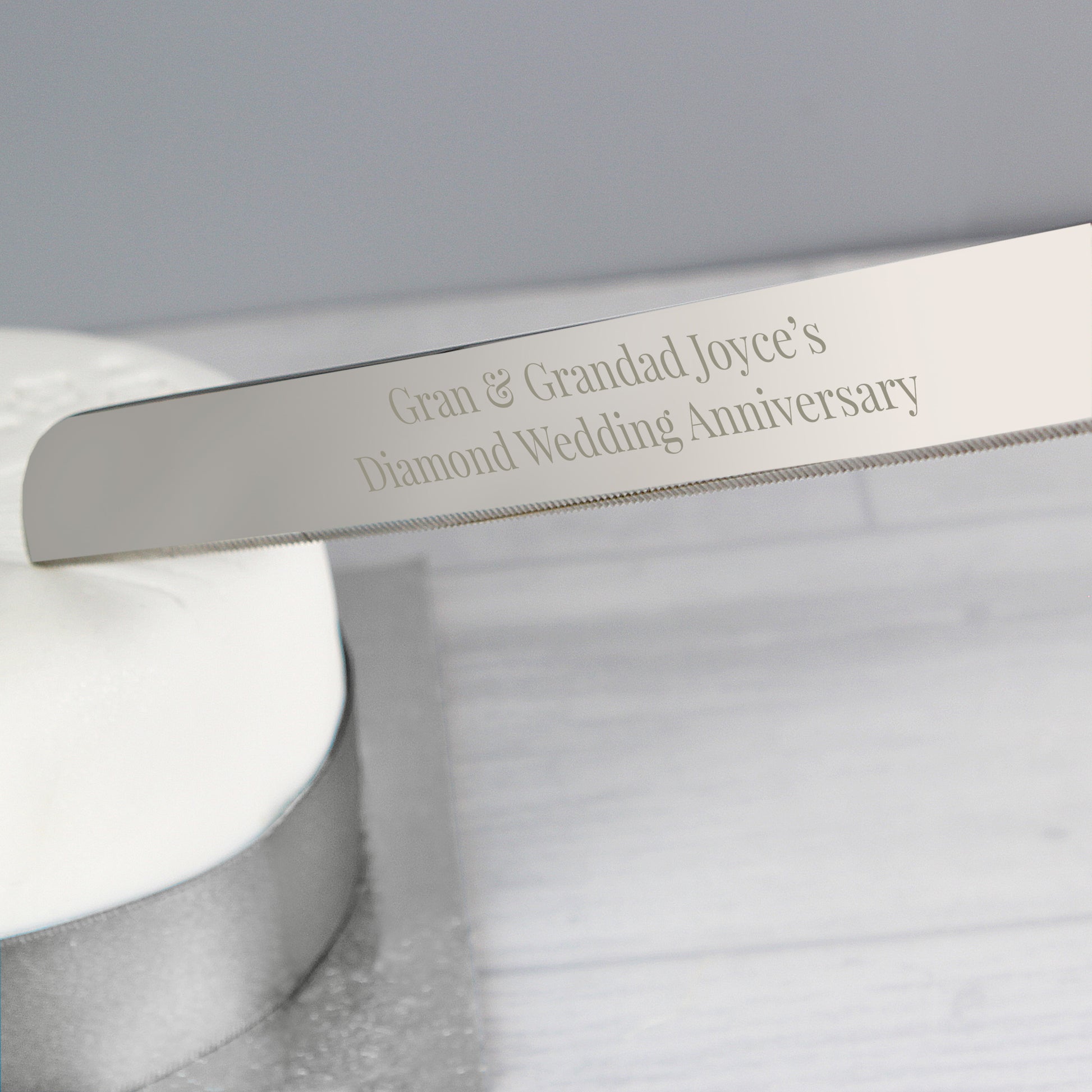 Personalised stainless steel cake knife engraved with the message of your choice