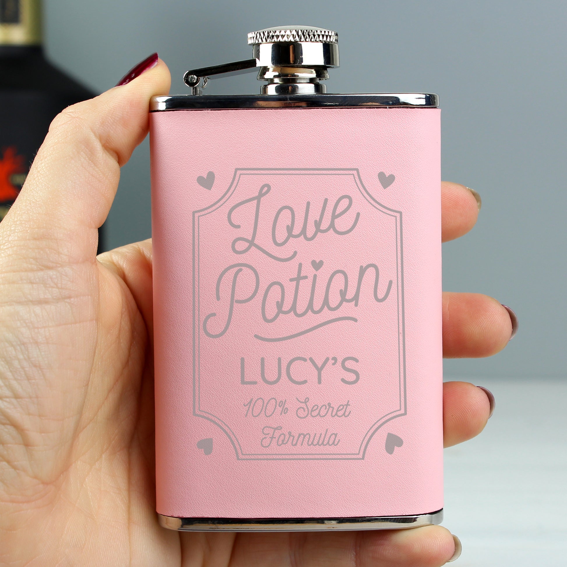 Pink hip flask "Love Potion, secret formula, can be personalised with a name of your choice.