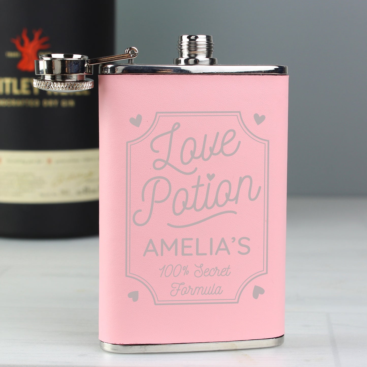 Pink hip flask "Love Potion, secret formula, can be personalised with a name of your choice.