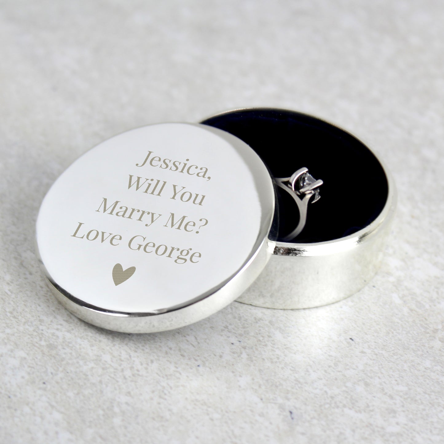 Personalised ring box with love heart carrying an engraved proposal