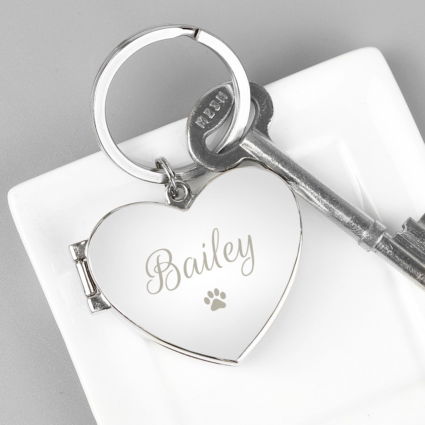 nickel plated opening locket key ring with paw print, engraved with your pet's name