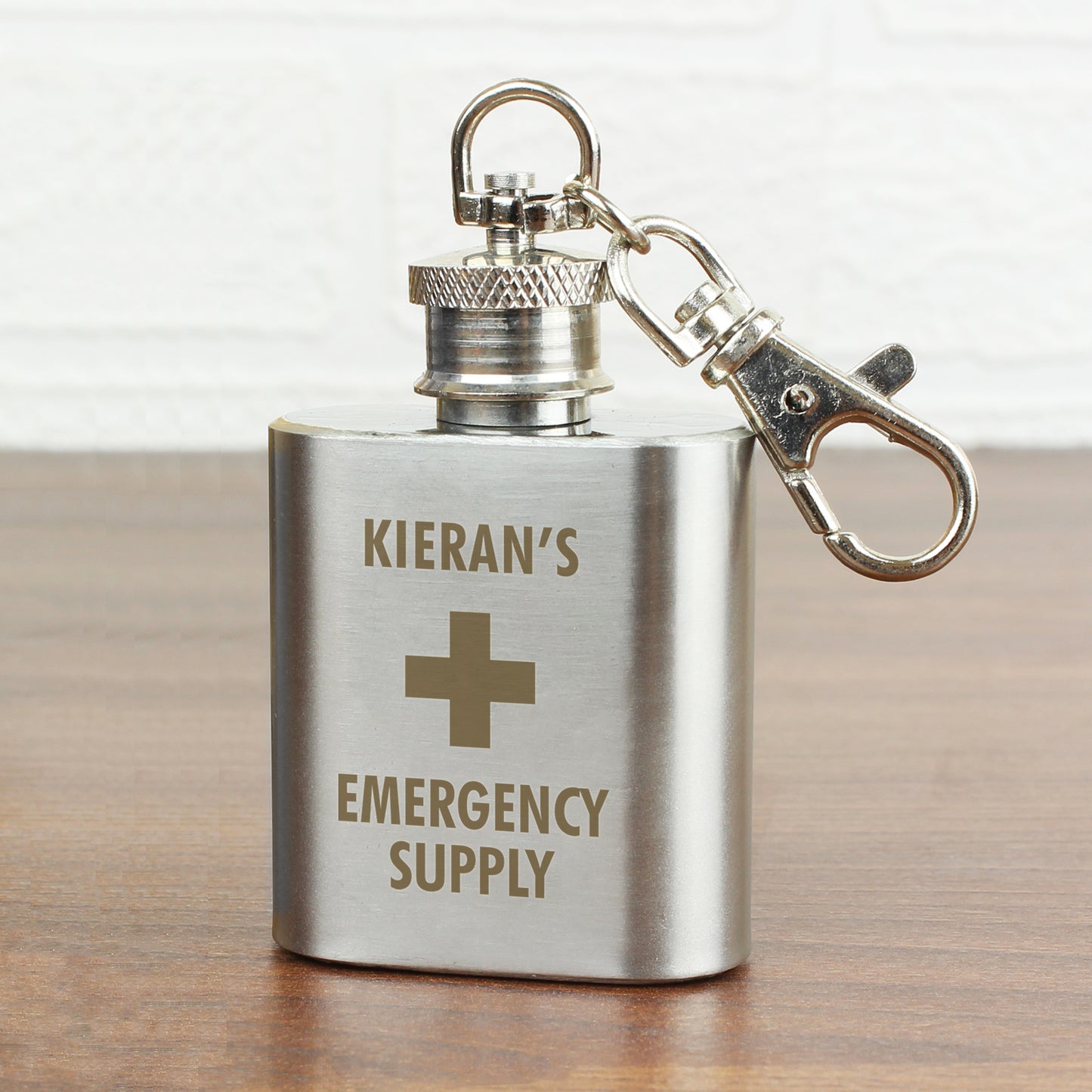 Small stainless steel flask with cross and Emergency Supply logo, personalise by adding a name. Screw top and lobster clasp to add to a key set