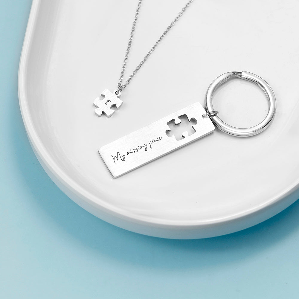 Perfect fit puzzle and keyring. The keyring has a missing jigsaw piece. The missing piece is on a pendant. Add a message to the keyring and an initial to the pendant.