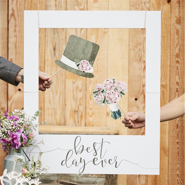 white polaroid type photo booth frame with best day ever in script below