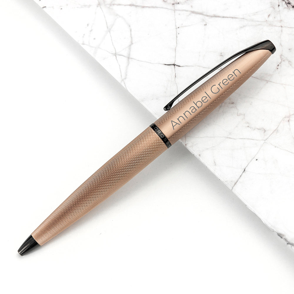 Cross ATX pen in matt rose gold etched pattern and black accents. Personalise with a name of your choice, shown with Sans Serif font
