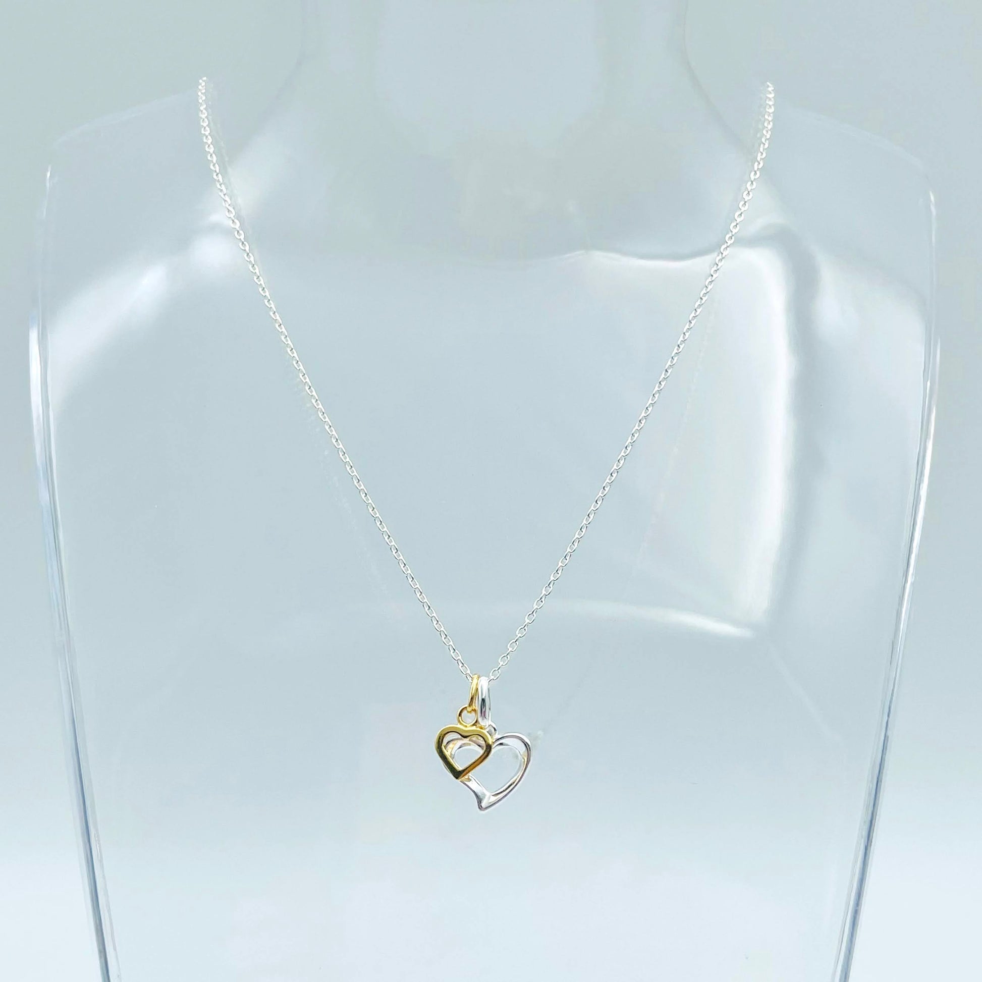 sterling silver heart and gold vermeil heart shown on 16-18" sterling silver chain. Wear them separately or together.