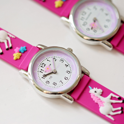 pink unicorn watch with 3d unicorn strap, clear watch face with time teaching figures and second hand