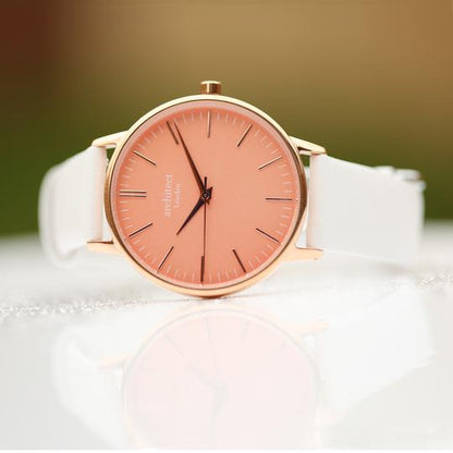 ladies engraved watch coral face