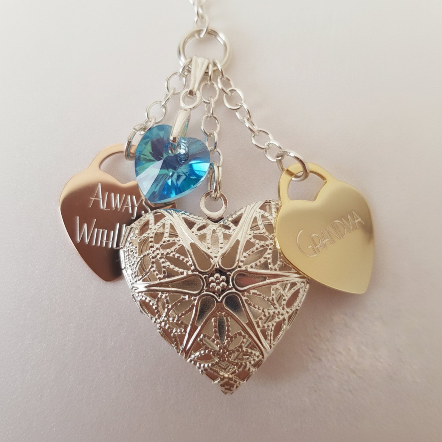 Because our wedding bouquet charm is handmade, we can customise to your choice. This charm has two engraved hearts. One saying Always With You and the other is engraved with Grandma