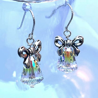 Stunning crystal bells with small crystal clapper, finished with silver bows and mounted onto sterling silver ear wires