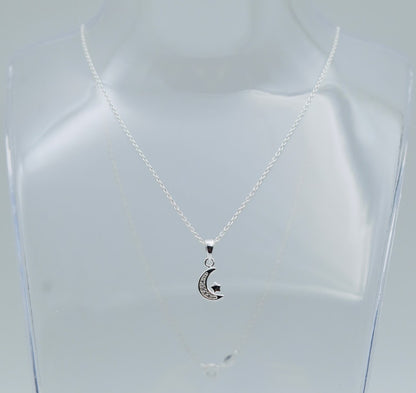 sterling silver crescent moon with cubic zircona and a tiny star hung from a sterling silver chain, shown on a display bust, Little Lockets London Message in a Bottle range