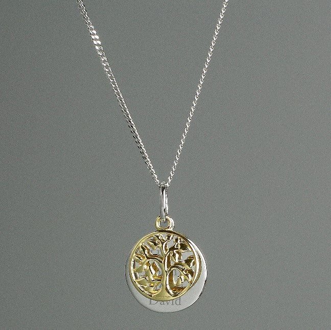 Sterling silver disc engraved with your own message, alongside a gold plated tree of life charm, family tree pendant