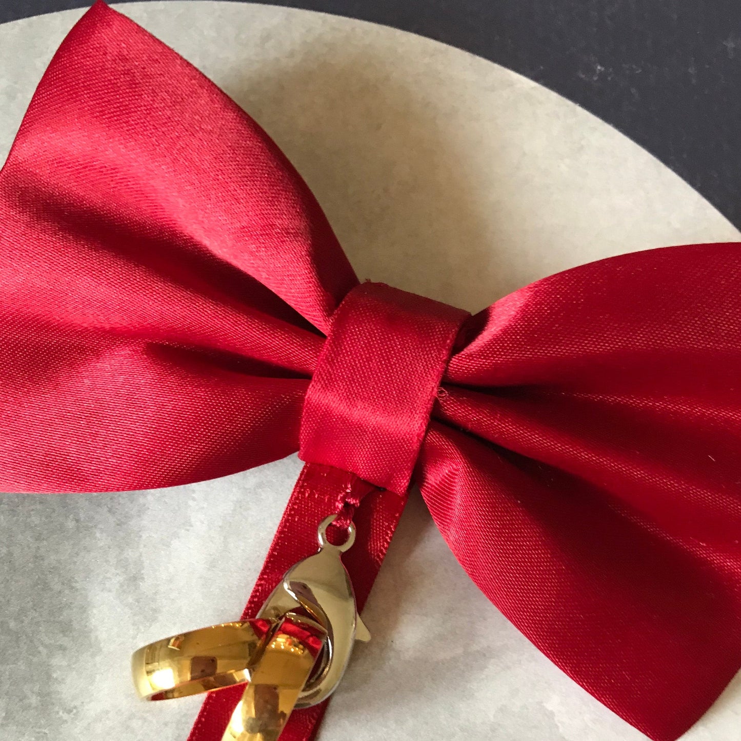 red ring bearer bow tie shown with optional ring carrier