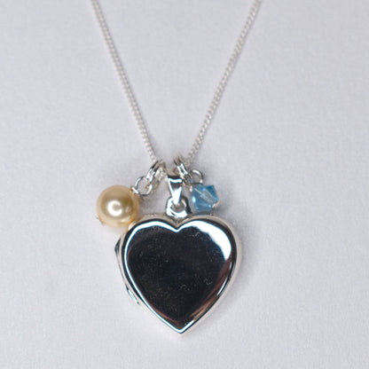 Sterling silver heart locket with pearl and blue stone