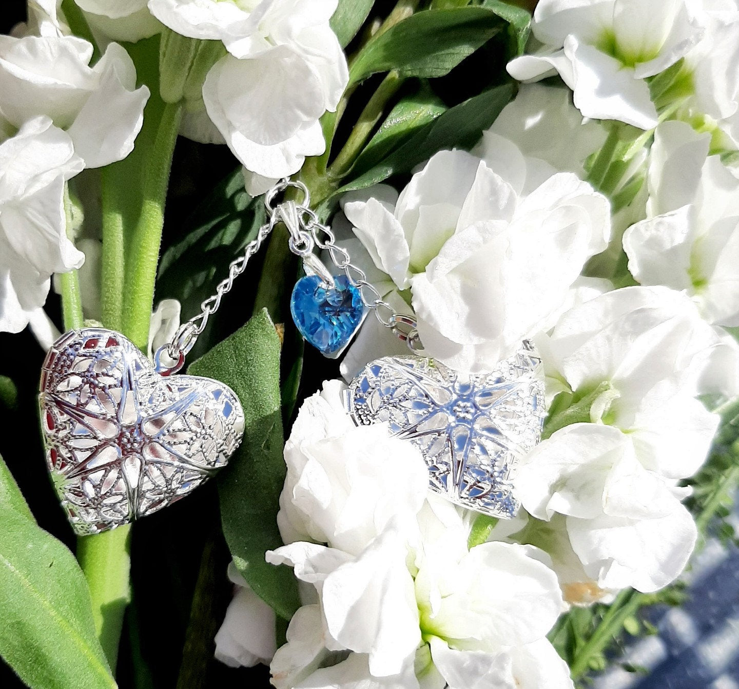 Two filigree lockets and blue heart for wedding bouquet charm on Brides bouquet